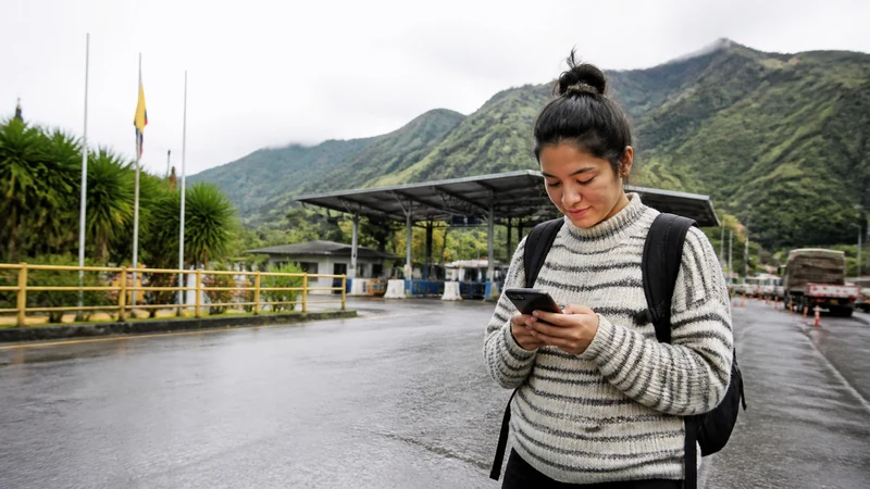 Traveller using a smartphone in Ecuador for ecuador colombia border internet