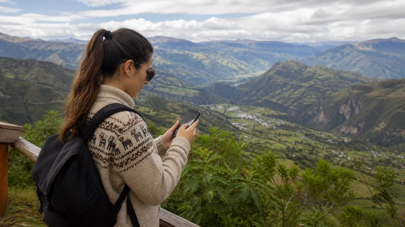 Traveller using a smartphone in Ecuador for ecuador esim android