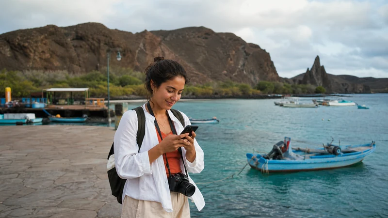 Traveller using a smartphone in Ecuador for ecuador esim for galapagos