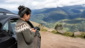 Traveller using a smartphone in Ecuador for ecuador esim for rental car