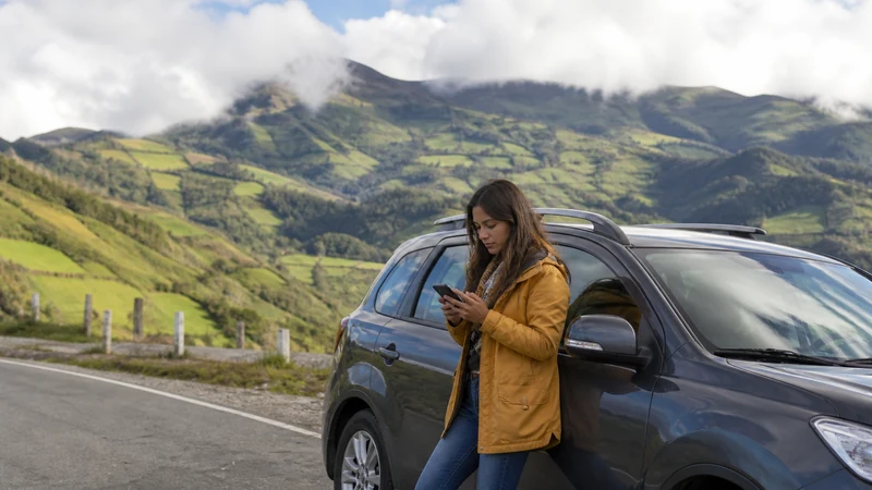 Traveller using a smartphone in Ecuador for ecuador offline maps road trip