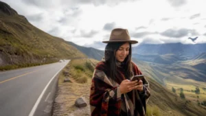 Traveller using a smartphone in Ecuador for ecuador road trip mobile internet
