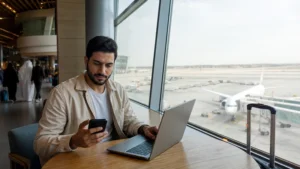 Traveller using a smartphone in Bahrain for esim vs airport wifi bahrain