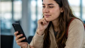 Traveller using a smartphone in Bolivia while researching bolivia esim vs airport wi-fi: which is more reliable?