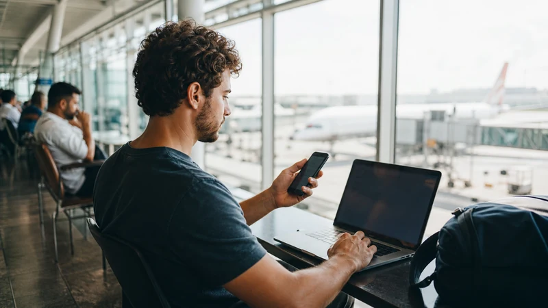Traveller using a smartphone in Brazil for esim vs airport wifi brazil