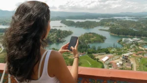 Traveller using a smartphone in Colombia for staying connected on a trip to guatapé