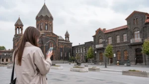 Traveller using a smartphone while using mobile internet in Gyumri