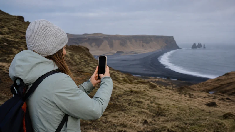Traveller using a smartphone in Iceland
