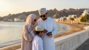 Family reviewing a phone beside qurum beach