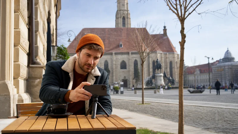 Traveller using a smartphone during how to get internet in romania in Romania.