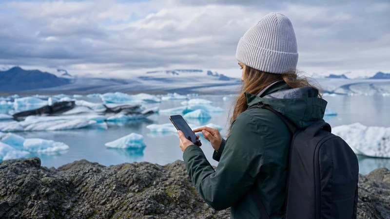 Traveller using a smartphone in Iceland