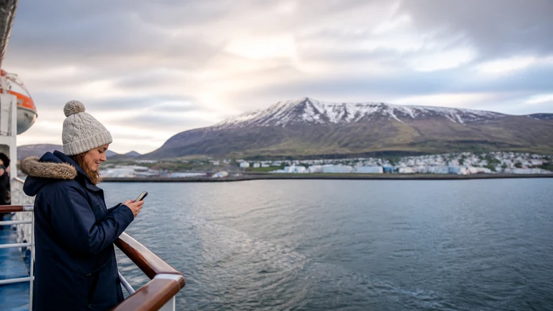 Traveller using a smartphone in Iceland