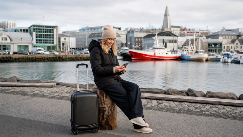 Traveller using a smartphone in Iceland