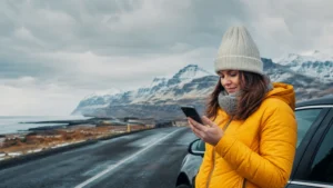 Traveller using a smartphone in Iceland
