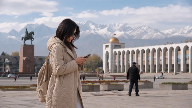 Traveller using a smartphone in Kyrgyzstan for internet bishkek tourists