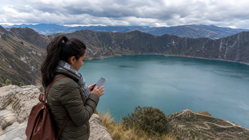 Traveller using a smartphone in Ecuador for internet guayaquil tourists