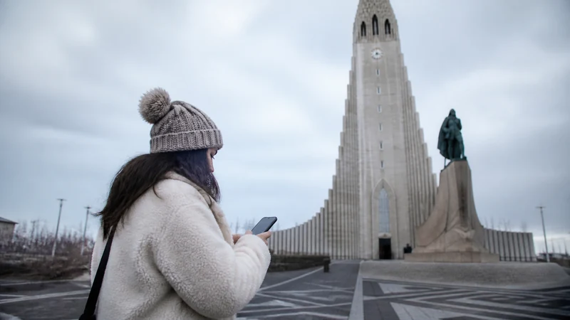 Traveller using a smartphone in Iceland