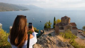 Traveller using a smartphone during internet in ohrid for tourists in North Macedonia.