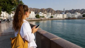 Traveller using a smartphone during tourist navigating in Muscat