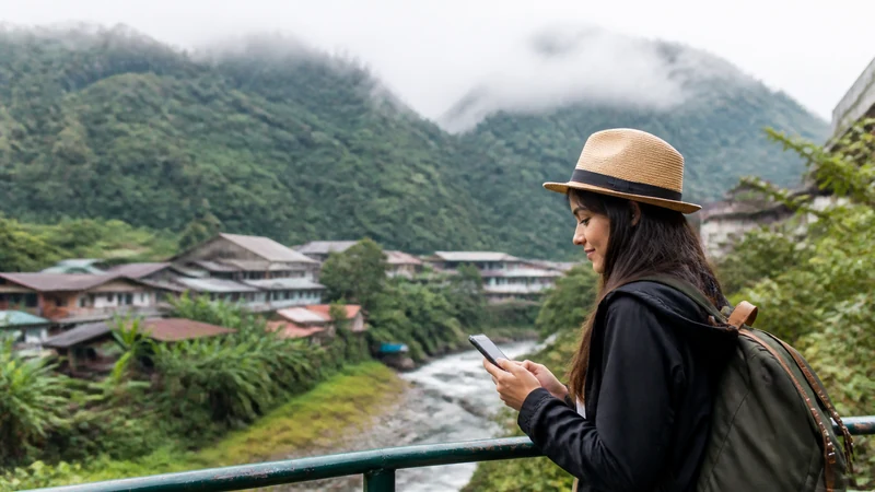 Traveller using a smartphone in Ecuador for internet quito tourists