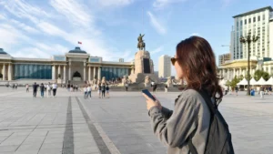 Traveller using a smartphone in Mongolia for internet ulaanbaatar tourists