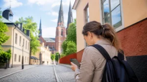 Traveller using a smartphone while preparing for internet in uppsala for tourists
