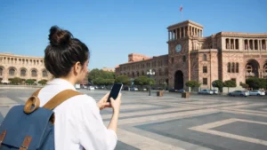 Traveller using a smartphone while staying connected in Yerevan