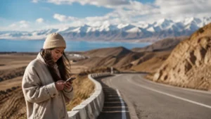 Traveller using a smartphone in Kyrgyzstan for issyk kul karakol mobile internet