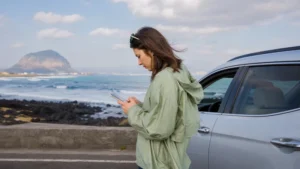 Traveller checking navigation on a Jeju Island road trip