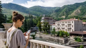 Traveller using a smartphone while using mobile internet in Jermuk