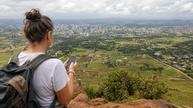 Traveller using a smartphone during a trip in Kenya