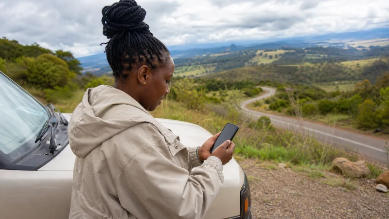Traveller using a smartphone during a trip in Kenya