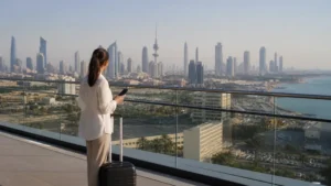 Traveller using a smartphone in a Kuwait setting related to is a kuwait esim worth it for a short stopover?