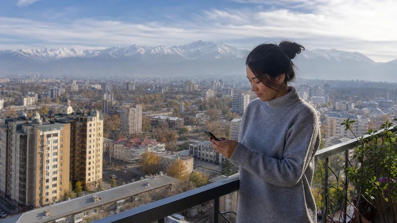 Traveller using a smartphone in Kyrgyzstan for kyrgyzstan long stay mobile internet
