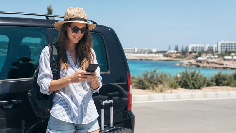 Traveller using a smartphone during larnaca to ayia napa mobile internet guide