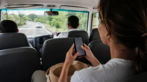Traveller using a smartphone in Costa Rica for getting mobile data from liberia airport to tamarindo