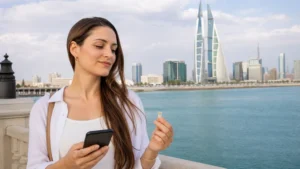 Traveller using a smartphone in Bahrain for local sim vs esim bahrain