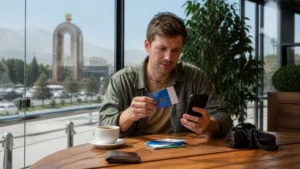 Traveller comparing a local SIM and eSIM in Dushanbe
