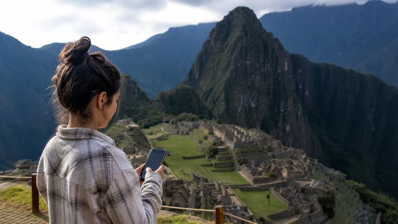 Traveller using a smartphone in Peru for machu picchu mobile internet