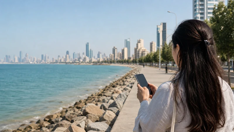 Traveller using a smartphone in a Kuwait setting related to mobile data and connectivity in mahboula