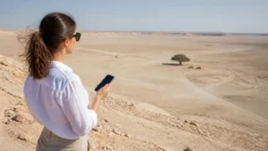 Traveller using a smartphone in Bahrain for manama tree of life mobile internet