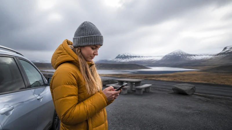 Traveller using a smartphone in Iceland