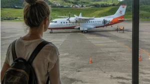 Traveller using a smartphone in Mauritius while researching mobile internet for travel between mauritius and rodrigues