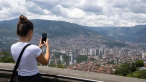 Traveller using a smartphone in Colombia for using mobile internet while staying in medellín