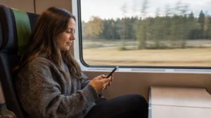 Traveller using a smartphone while preparing for mobile data in sweden: what travellers need to know
