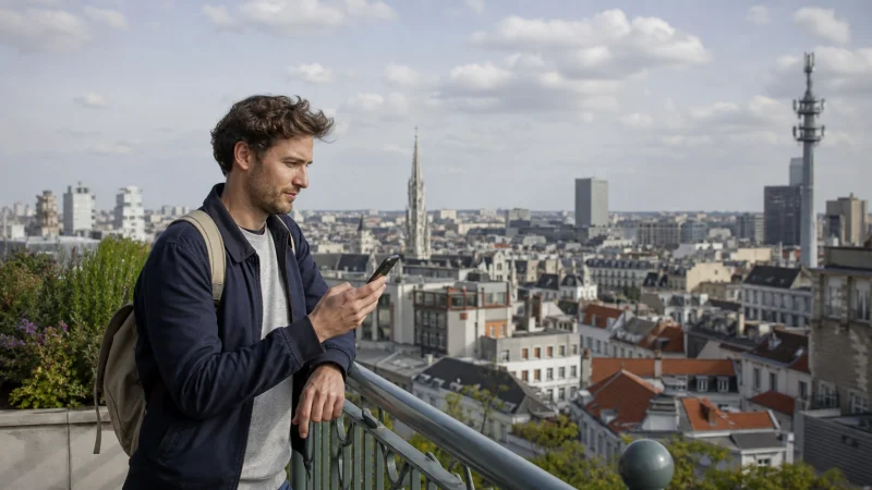 Traveller using a smartphone during a trip in Belgium