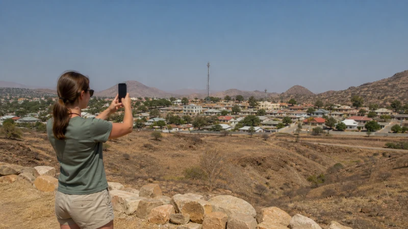 Traveller using a smartphone in Namibia while comparing mobile networks in Namibia