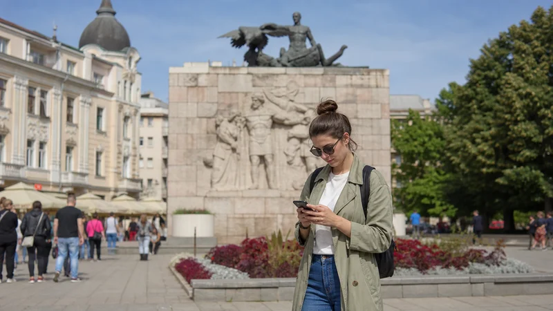 Traveller using a smartphone during mobile networks in serbia in Serbia.