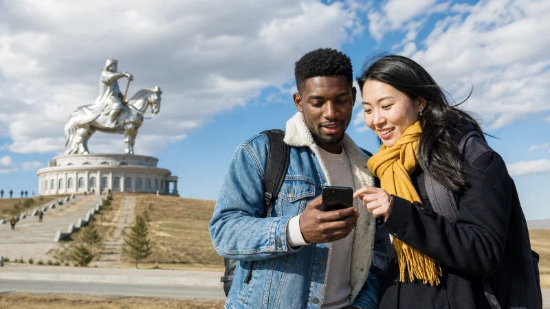 Traveller using a smartphone in Mongolia for mongolia short trip mobile data