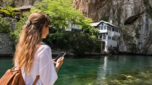 Traveller using a smartphone during mostar to blagaj mobile internet and intercity bus connectivity guide in Bosnia and Herzegovina.